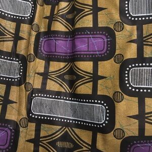 Geometric Patterned Fabric in Gold and Purple